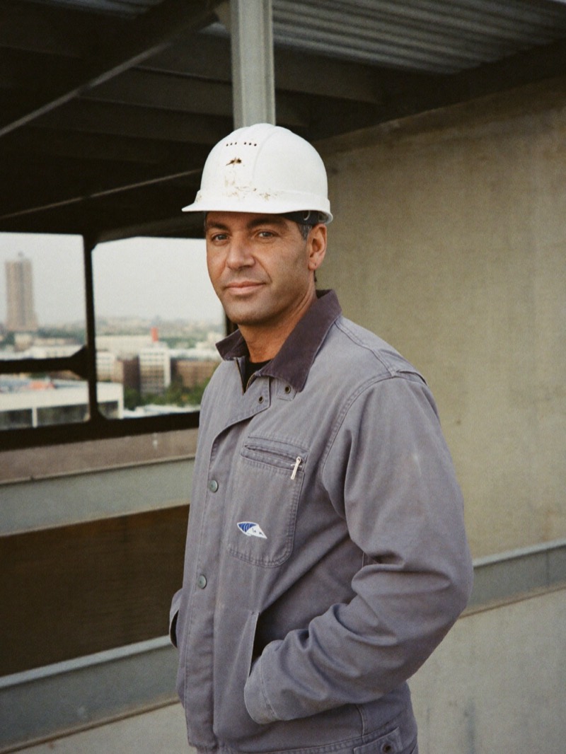Builder on an upper floor of a building under construction